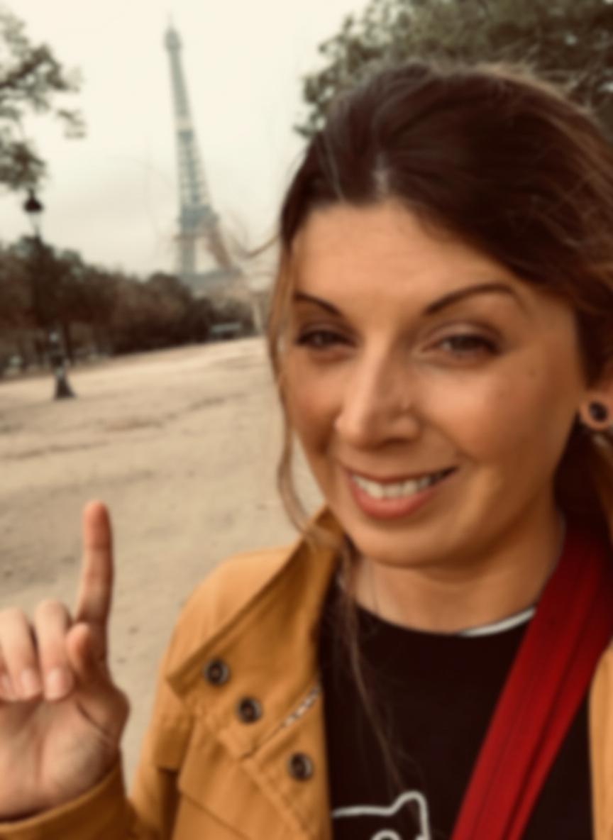 Apply a soft, subtle blur to this existing portrait image to create a dreamy, de-focused effect that still keeps the overall shapes recognizable.